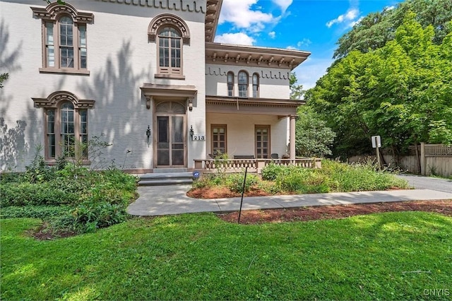 italianate home with a front yard