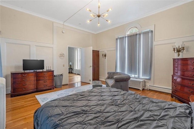 bedroom featuring light wood-type flooring, ornamental molding, a chandelier, and baseboard heating