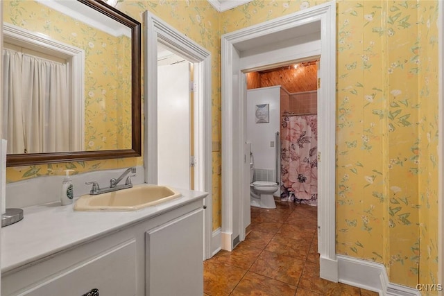 bathroom featuring crown molding, tile patterned flooring, vanity, toilet, and walk in shower