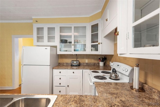 kitchen featuring white cabinetry, white appliances, tasteful backsplash, and stone counters