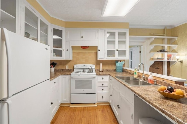 kitchen with sink, white appliances, white cabinetry, ornamental molding, and light wood-type flooring