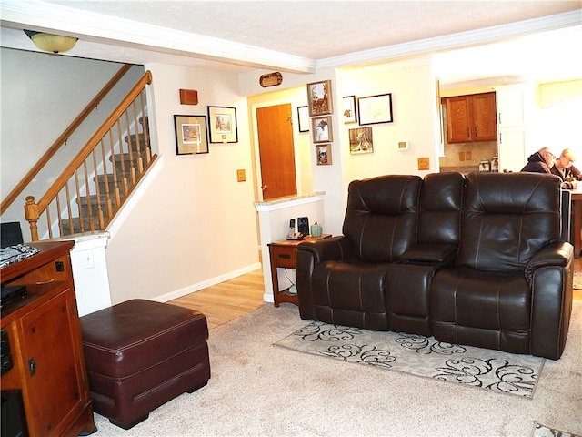 living room featuring crown molding and light carpet