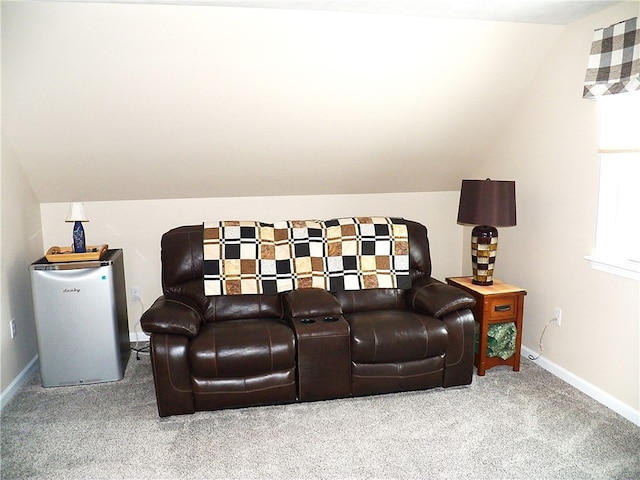 home theater room featuring lofted ceiling and carpet floors