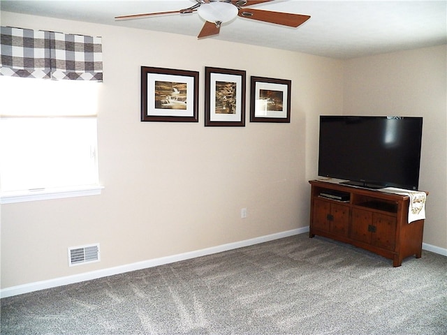 living room with light carpet and ceiling fan