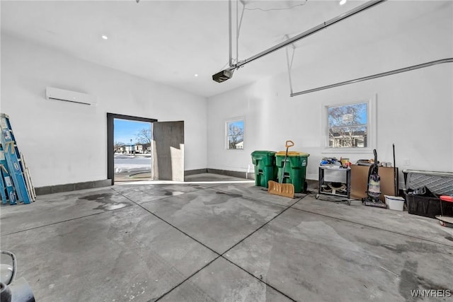 garage featuring a garage door opener and an AC wall unit