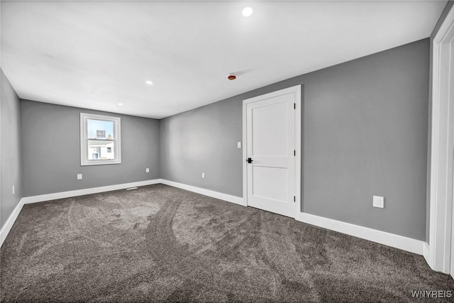 empty room featuring carpet flooring