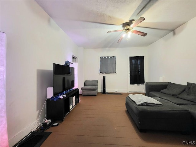 living room featuring hardwood / wood-style flooring and ceiling fan