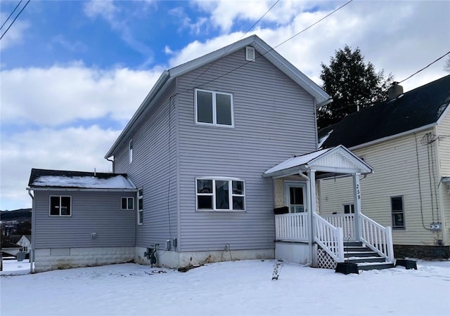 view of snow covered property