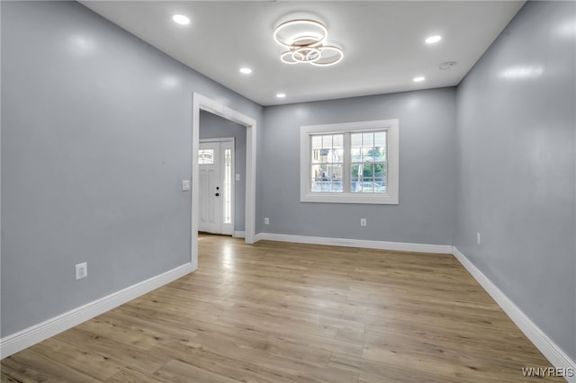 spare room featuring light wood-type flooring