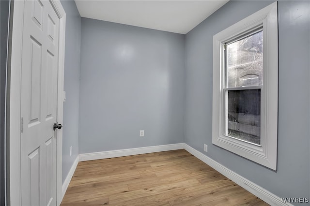 spare room featuring light wood-type flooring