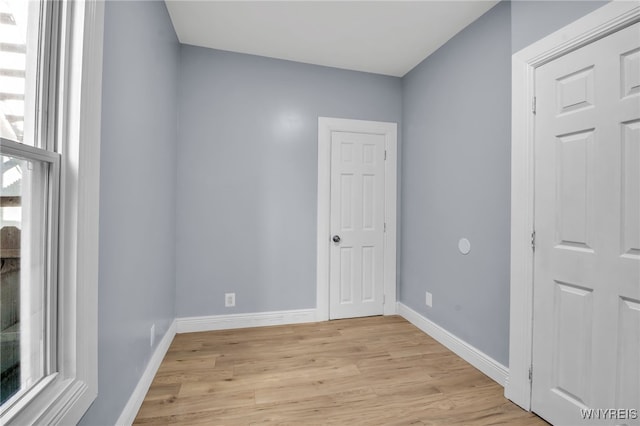 spare room with light wood-type flooring