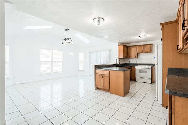 kitchen with light tile patterned floors, hanging light fixtures, electric range, lofted ceiling with skylight, and kitchen peninsula