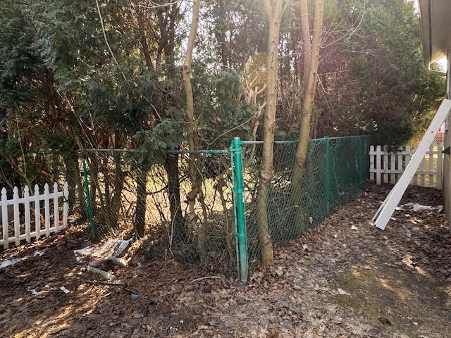 view of gate featuring fence