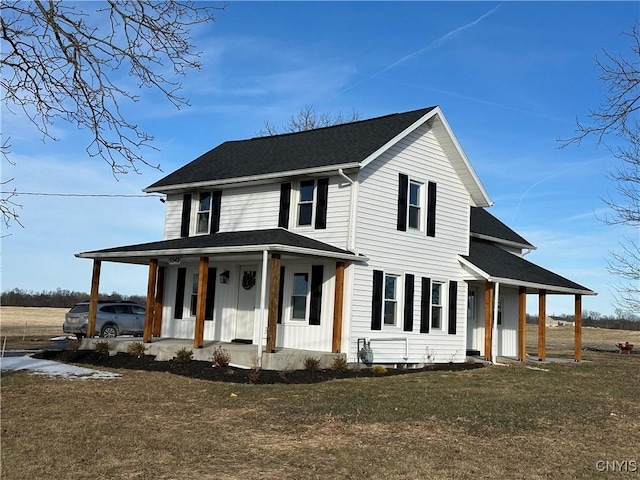 view of front of property featuring a porch and a front yard