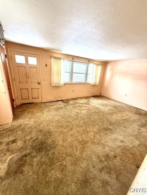 interior space featuring a textured ceiling