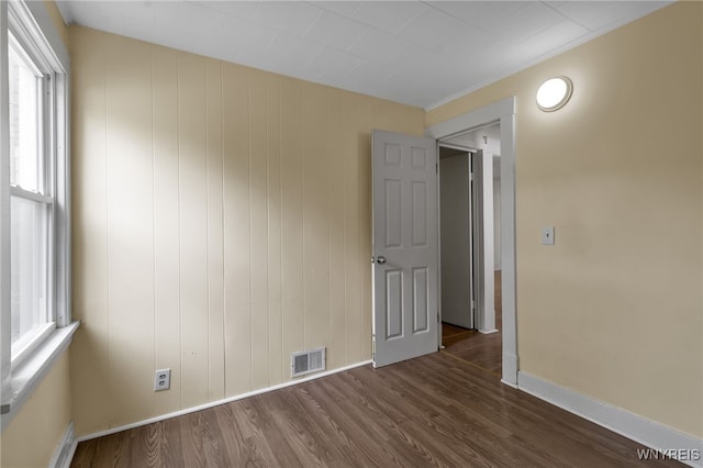 spare room with dark hardwood / wood-style flooring