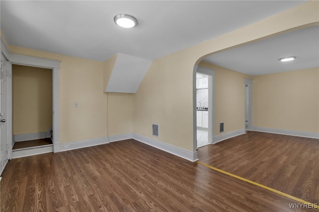 bonus room featuring dark hardwood / wood-style floors