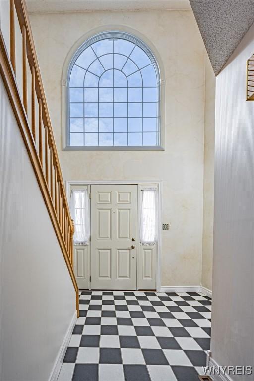 foyer entrance featuring a high ceiling