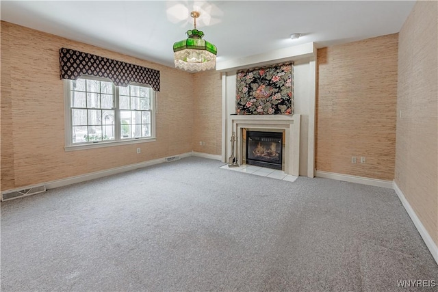 unfurnished living room featuring light colored carpet