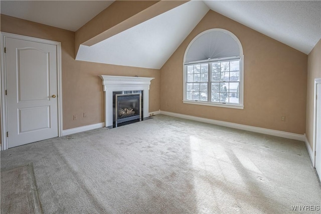 unfurnished living room featuring light colored carpet and lofted ceiling