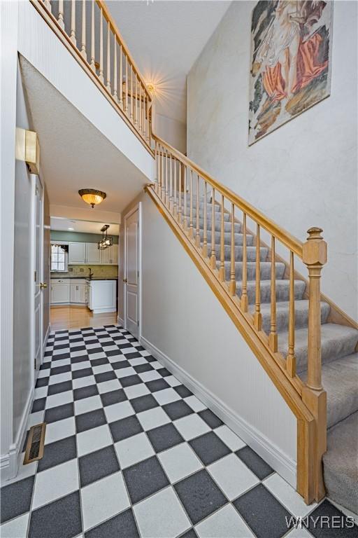 stairway with a towering ceiling