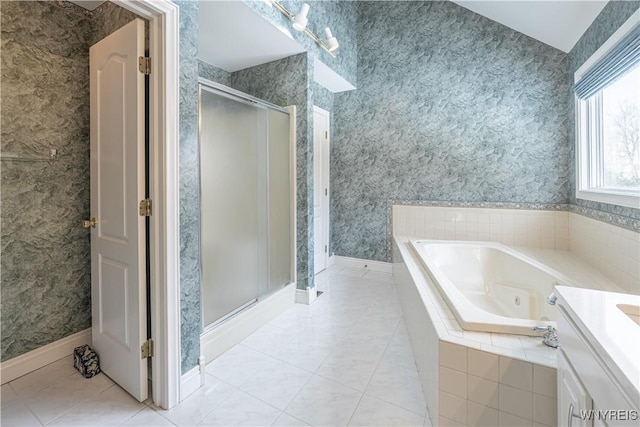 bathroom featuring vanity, shower with separate bathtub, and tile patterned flooring