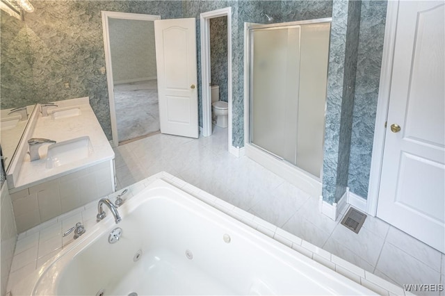 full bathroom with plus walk in shower, sink, tile patterned floors, and toilet