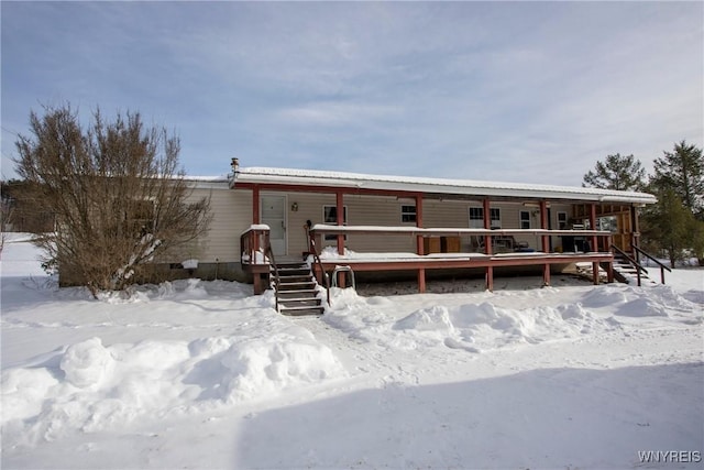 view of front of home featuring a wooden deck