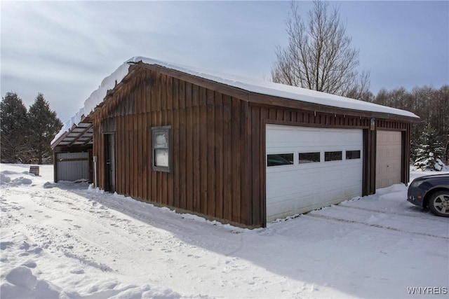 view of snow covered garage