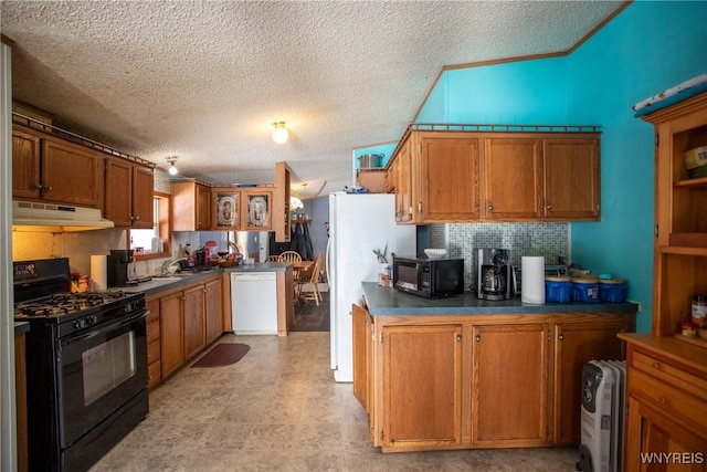 kitchen with sink, backsplash, a textured ceiling, and black appliances