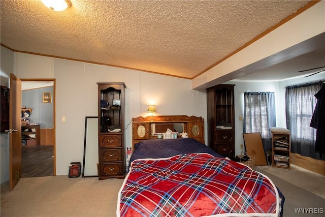 carpeted bedroom with crown molding and a textured ceiling