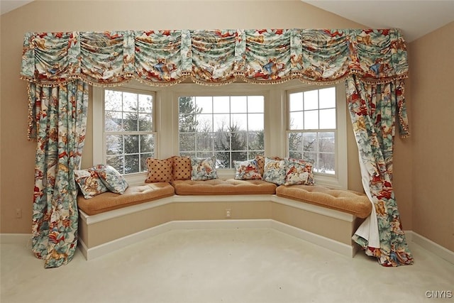 unfurnished room featuring vaulted ceiling