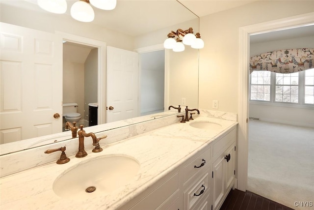 bathroom with vanity and toilet