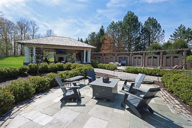 view of patio featuring a gazebo and an outdoor fire pit