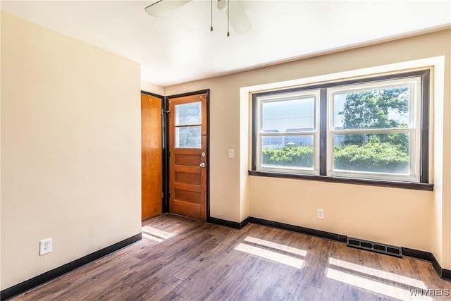 foyer entrance featuring hardwood / wood-style flooring and ceiling fan