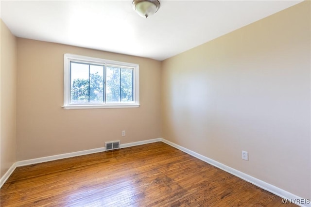 empty room featuring wood-type flooring