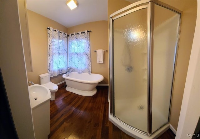 full bathroom featuring vanity, hardwood / wood-style floors, shower with separate bathtub, and toilet