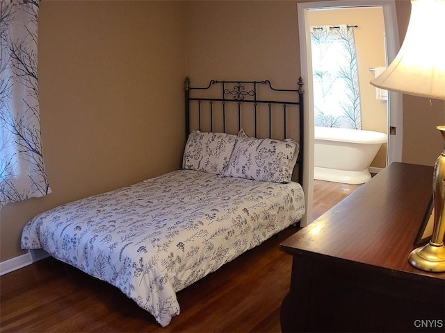 bedroom featuring dark hardwood / wood-style flooring