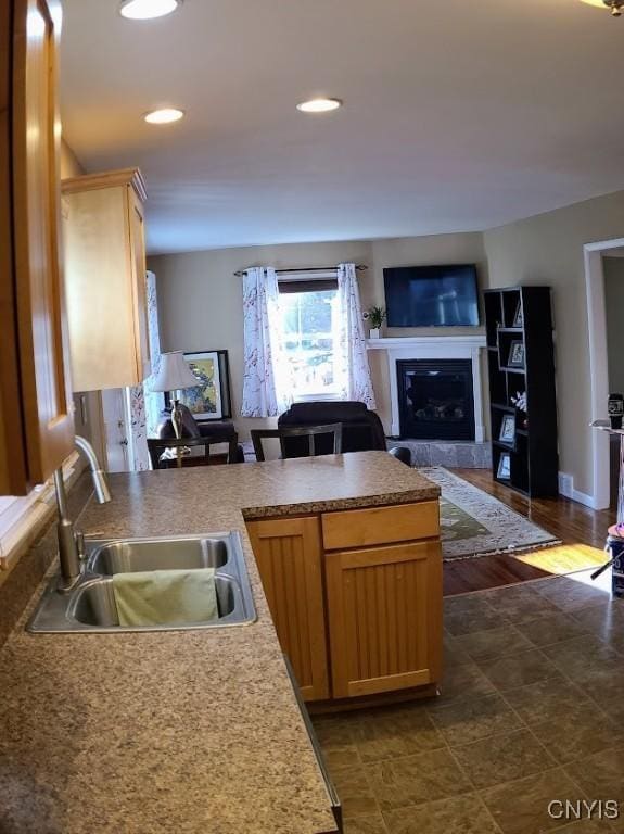 kitchen featuring sink and light brown cabinetry