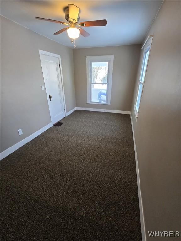 unfurnished room featuring carpet flooring and ceiling fan