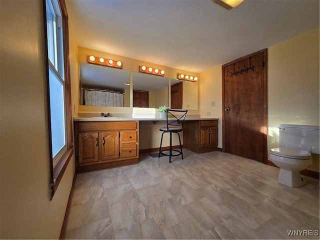 bathroom with vanity and toilet