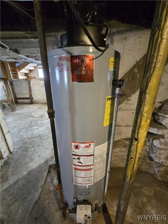 utility room with gas water heater