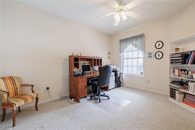 carpeted office with ceiling fan