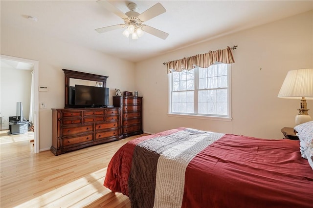 bedroom featuring light hardwood / wood-style flooring and ceiling fan