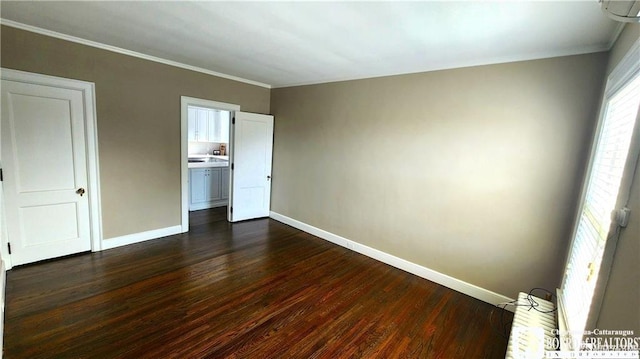 unfurnished bedroom with dark hardwood / wood-style flooring and ornamental molding