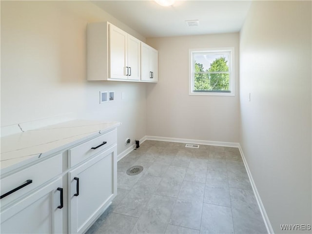 washroom featuring cabinets and washer hookup