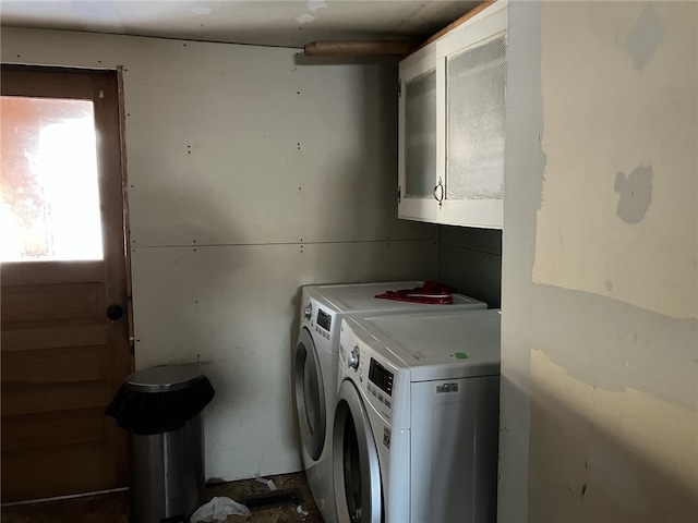 laundry area featuring cabinets and washing machine and clothes dryer