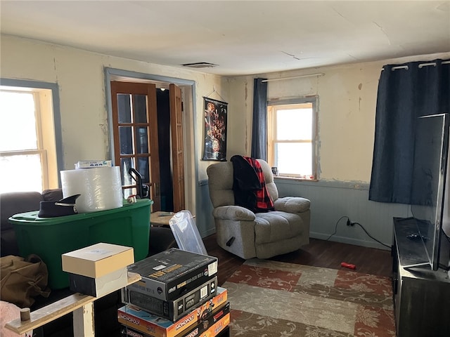 sitting room with dark hardwood / wood-style flooring