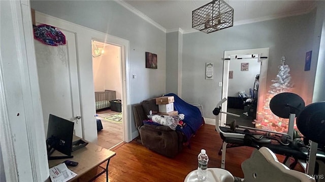 living room with wood-type flooring and ornamental molding