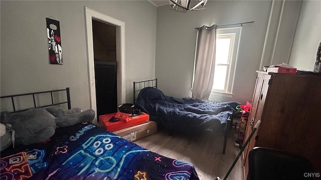 bedroom featuring wood finished floors